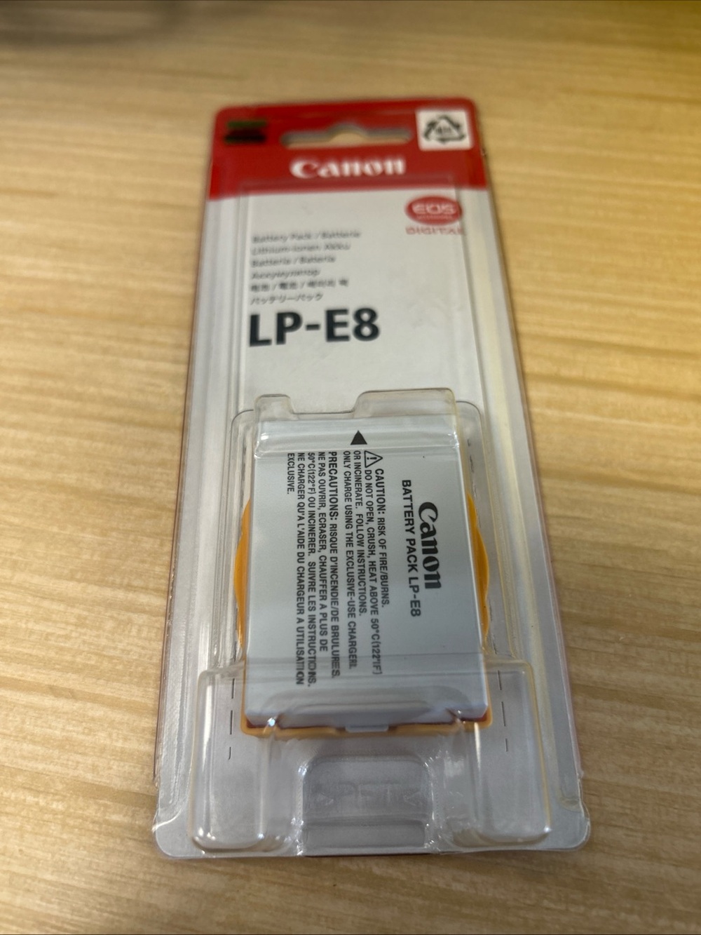Canon LP-E8 Camera Battery Pack in White and Orange
